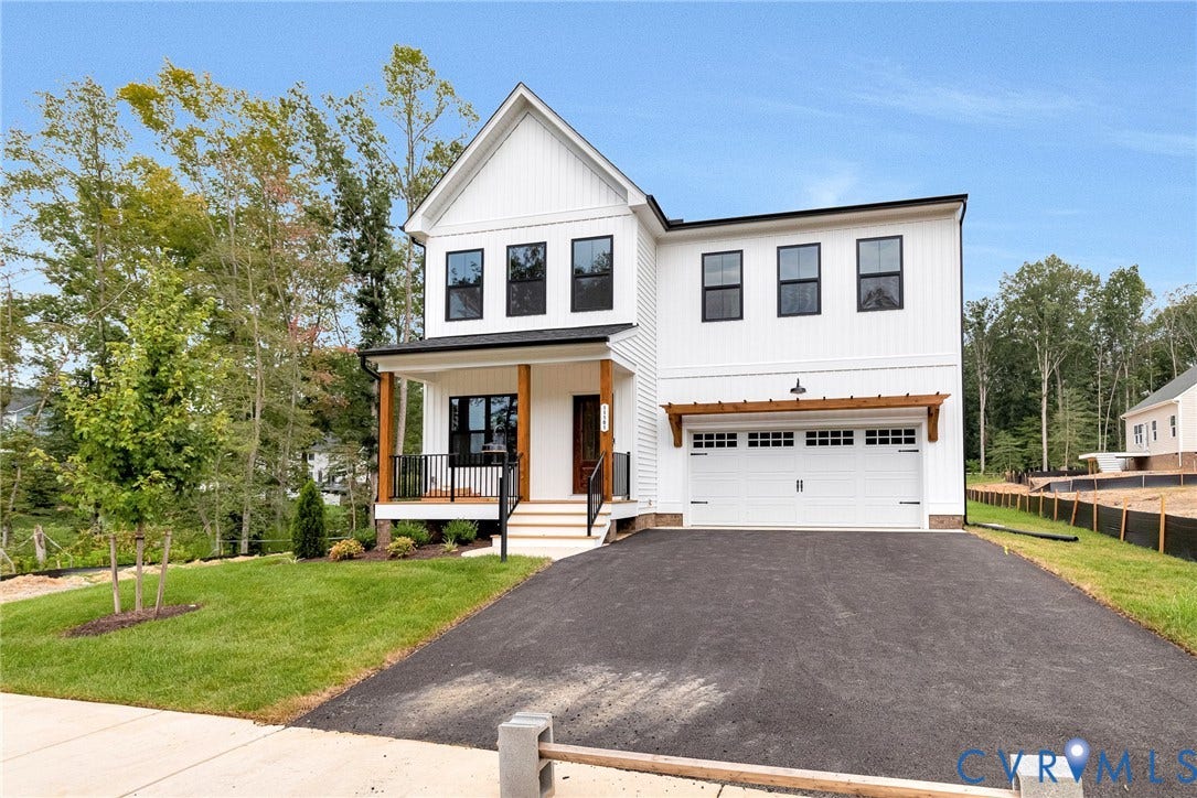 11101 Somerset Hill Drive, Somerset Hills, Glen Allen, VA 23059 Modern farmhouse exterior with white vertical siding, black-framed windows, and a covered porch with natural wood columns