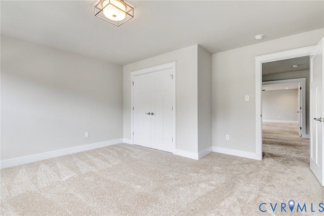 11101 Somerset Hill Drive, Somerset Hills, Glen Allen, VA 23059 Light gray wall color, neutral carpeting, recessed closet doors, overhead geometric light fixture, and white trim throughout