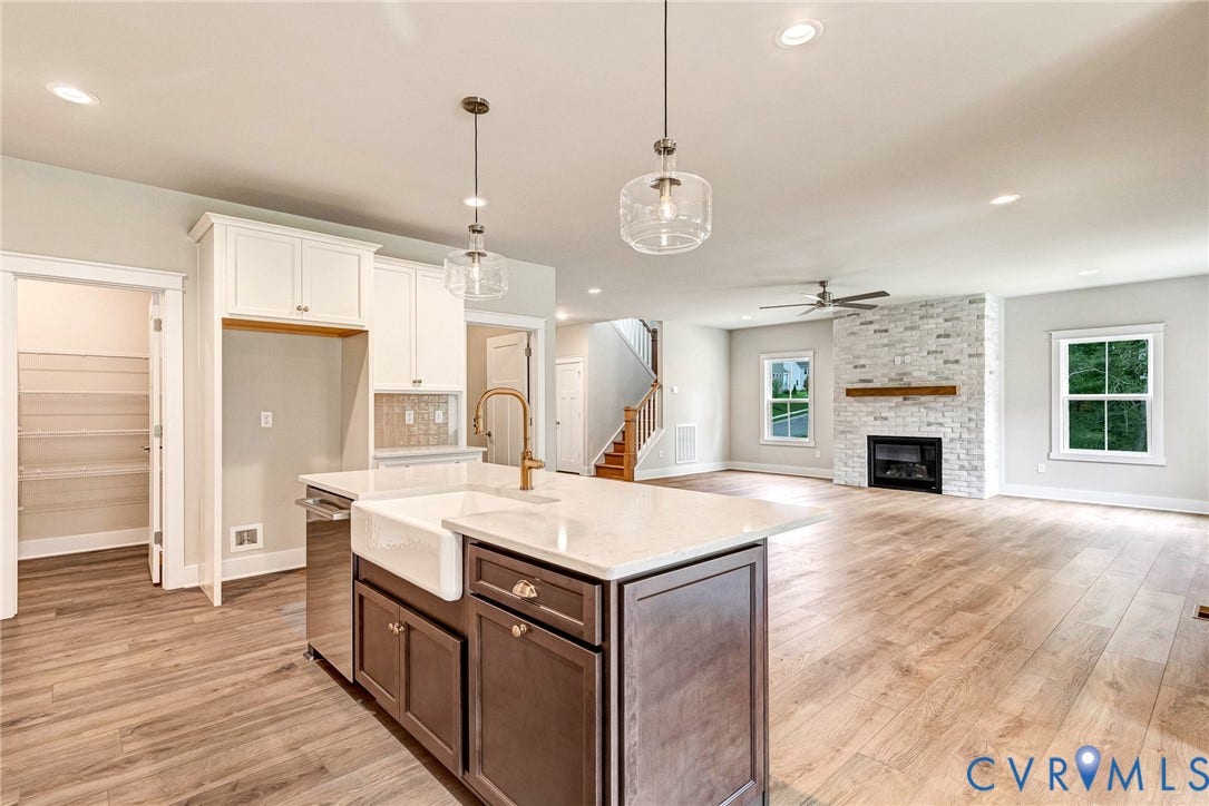 11101 Somerset Hill Drive, Somerset Hills, Glen Allen, VA 23059 Kitchen island with a white farmhouse sink, pendant lighting, and wood-finish flooring