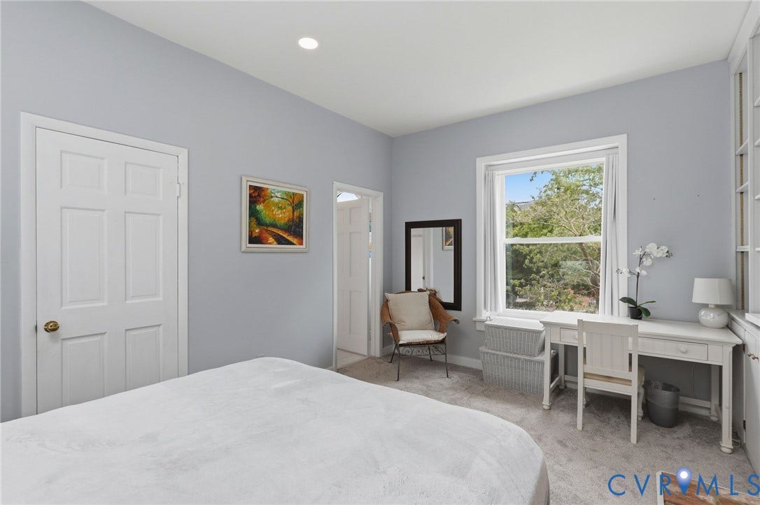 404 N Shields Avenue, Richmond, VA 23220 Room featuring a recessed ceiling light, paneled door with brass hardware, and carpet flooring