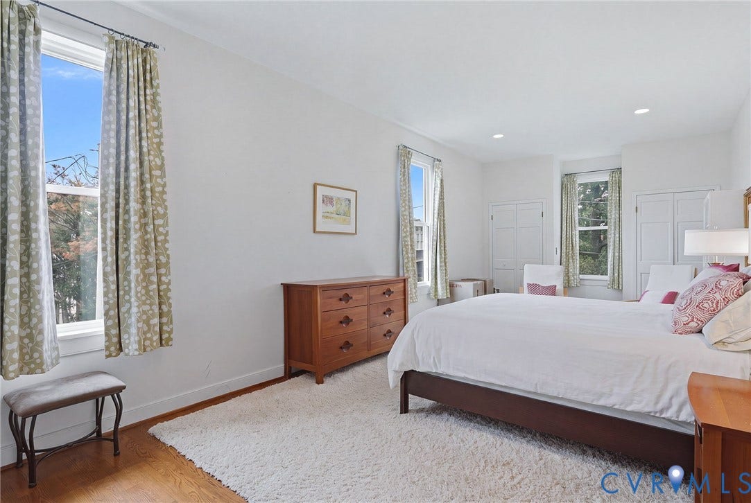 404 N Shields Avenue, Richmond, VA 23220 Hardwood flooring with a soft area rug, four pane windows, white walls, and recessed ceiling lighting