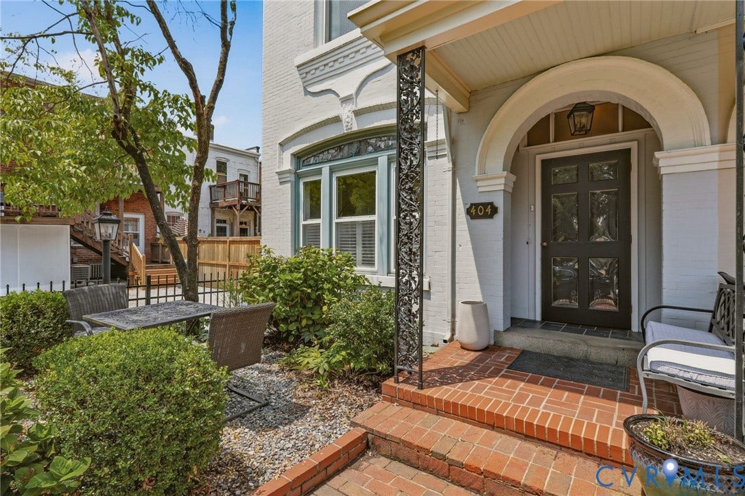 404 N Shields Avenue, Richmond, VA 23220 Brick walkway leading to an arched entry with a panel door