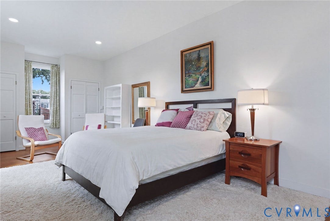 404 N Shields Avenue, Richmond, VA 23220 Bright bedroom featuring recessed lighting, a window with exterior views, white bi-fold closet doors, and wood-finish flooring