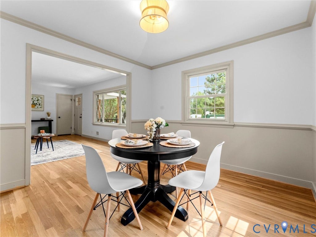 10400 Claybar Trail, Chesterfield, VA 23236 Dining area featuring wood-finish flooring, a decorative overhead light fixture, and a large window with exterior views