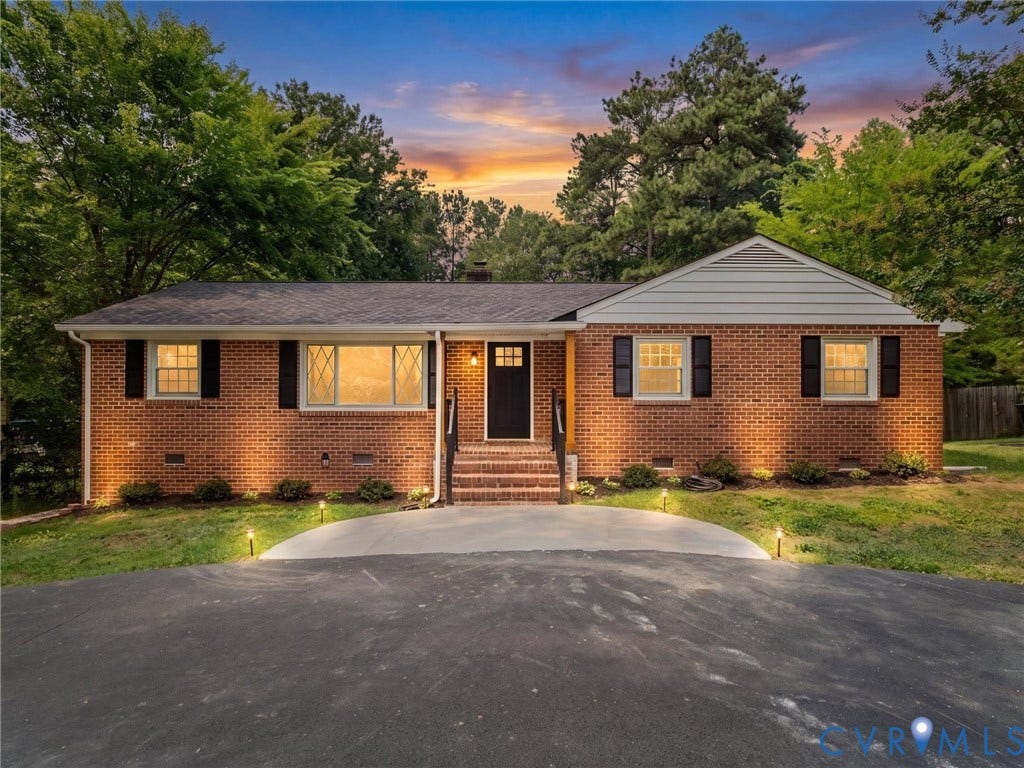 10400 Claybar Trail, Chesterfield, VA 23236 Brick exterior featuring dark shutters and a black front door
