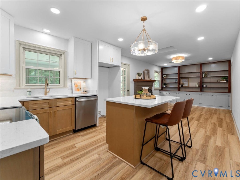 10400 Claybar Trail, Chesterfield, VA 23236 Open-concept kitchen featuring an island with white countertop, recessed lighting, and wood-finish flooring