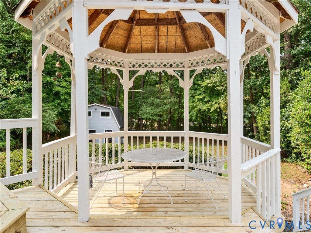 10400 Claybar Trail, Chesterfield, VA 23236 White wooden gazebo with latticework detailing and a natural wood ceiling