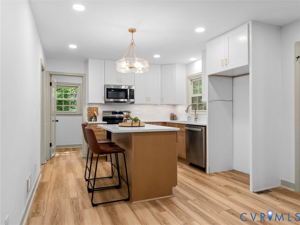 10400 Claybar Trail, Chesterfield, VA 23236 Bright kitchen featuring a central island, stainless steel appliances, white cabinetry, wood-finish flooring, and recessed lighting