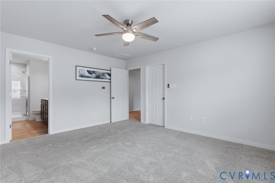 6544 Bolles Landing Court, Chester, VA 23831 Spacious room featuring light grey carpeting and a ceiling fan with light fixture