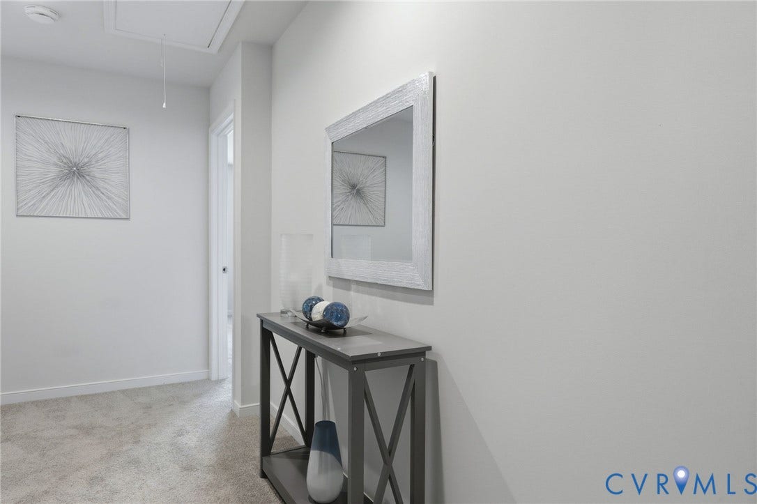 6544 Bolles Landing Court, Chester, VA 23831 Carpeted hallway featuring light-toned walls and built-in overhead lighting
