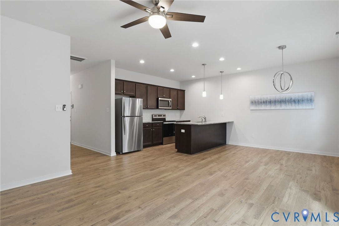 6544 Bolles Landing Court, Chester, VA 23831 Open-concept living area featuring wood-finish flooring, recessed lighting, and a ceiling fan