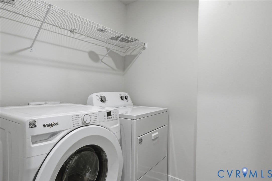 6544 Bolles Landing Court, Chester, VA 23831 Dedicated laundry area featuring a white Whirlpool front-load washer and a white dryer