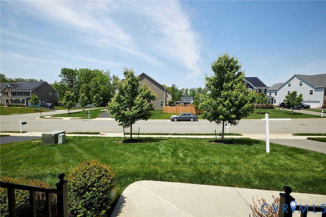 4535 Paxton Glen Court, 3W120, Glen Allen, VA 23059 Expansive front lawn with mature greenery, concrete sidewalk, and street view