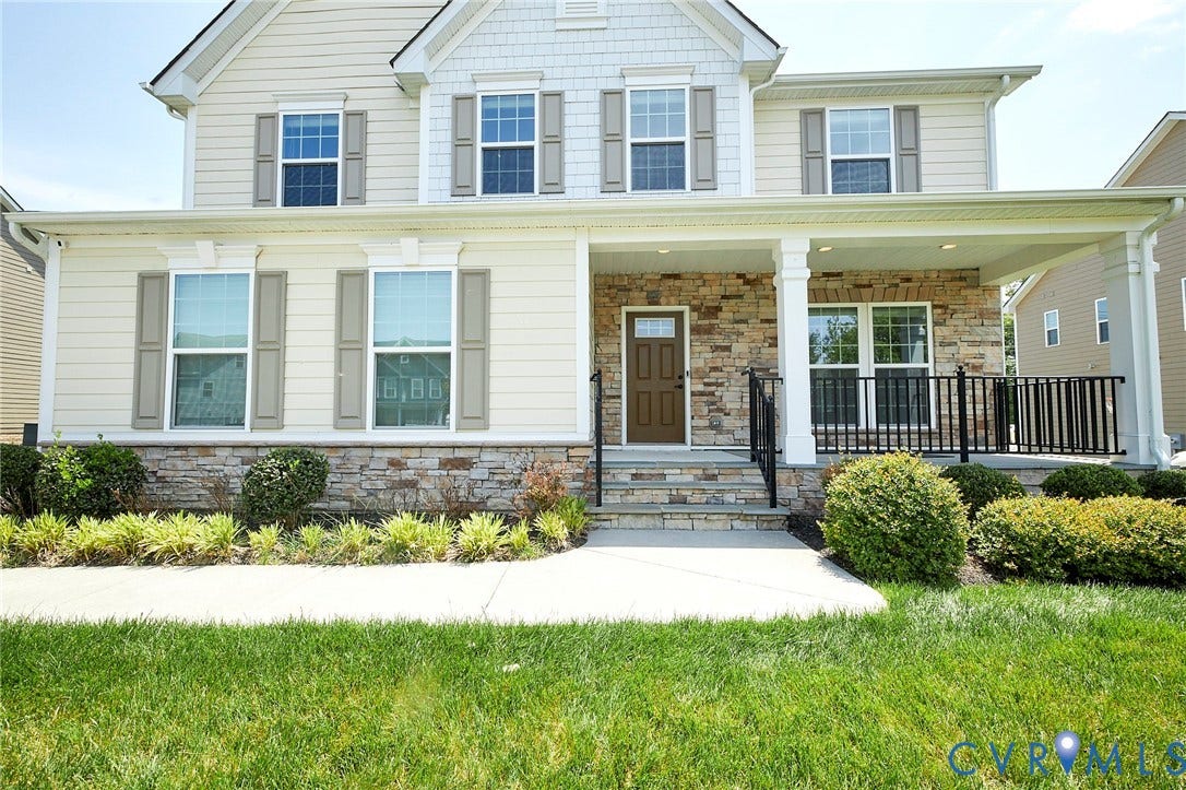 4535 Paxton Glen Court, 3W120, Glen Allen, VA 23059 Two-story residence featuring a stone and siding facade, covered front porch, decorative shutters, and an inviting entry door with a glass insert