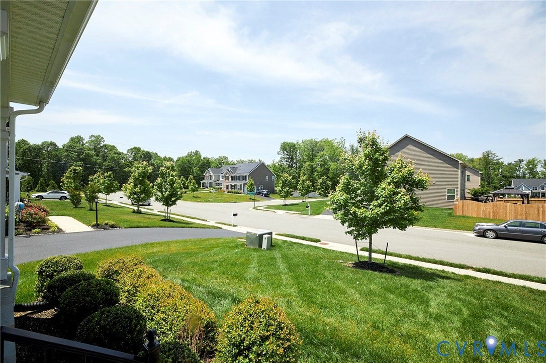 4535 Paxton Glen Court, 3W120, Glen Allen, VA 23059 Manicured front yard with mature shrubbery and a paved driveway