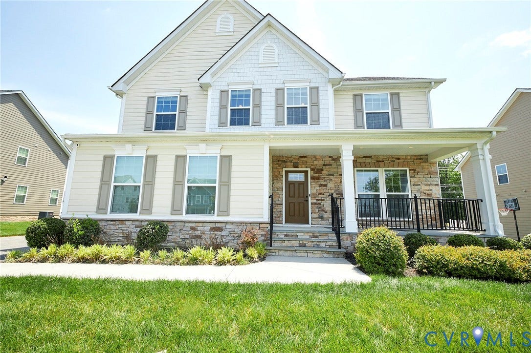 4535 Paxton Glen Court, 3W120, Glen Allen, VA 23059 Two-story residence featuring light-colored siding, a stone facade, and a covered front porch with white columns and black railings