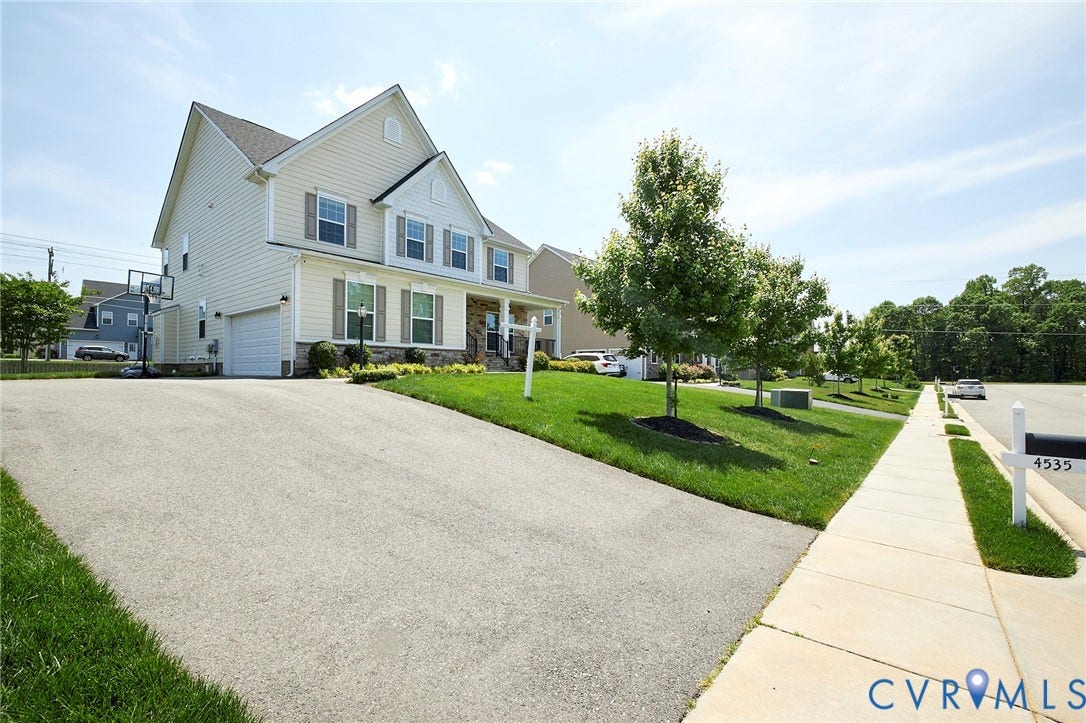 4535 Paxton Glen Court, 3W120, Glen Allen, VA 23059 Two-story home with a light-toned siding exterior, a front porch, and a two-car garage