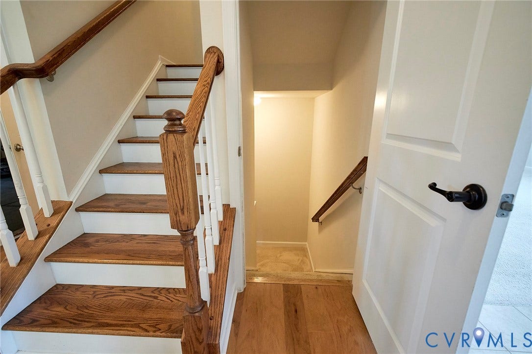 4535 Paxton Glen Court, 3W120, Glen Allen, VA 23059 Staircase with wood-finish treads and white risers, featuring a wood baluster and handrail