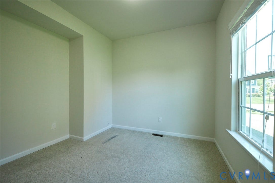 4535 Paxton Glen Court, 3W120, Glen Allen, VA 23059 Neutral-toned room featuring a large window with horizontal blinds, providing ample natural light