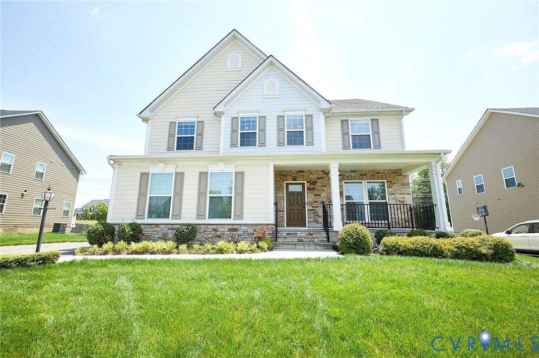 4535 Paxton Glen Court, 3W120, Glen Allen, VA 23059 Traditional-style residence featuring a prominent covered porch with stone columns, a stone faade accent, and a wood-finish entry door