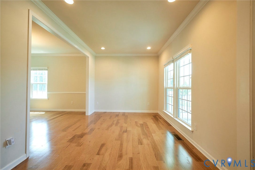 4535 Paxton Glen Court, 3W120, Glen Allen, VA 23059 Hardwood flooring extending throughout, recessed lighting, and multiple windows with blinds