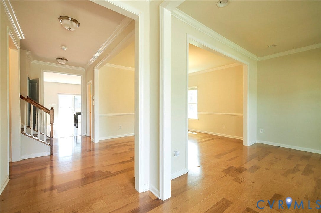 4535 Paxton Glen Court, 3W120, Glen Allen, VA 23059 Entryway featuring light wood-finish flooring, white trim, and neutral wall paint