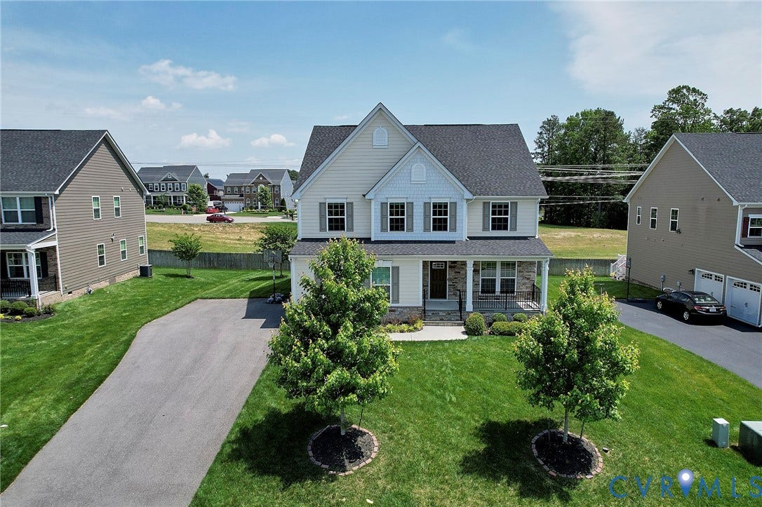 4535 Paxton Glen Court, 3W120, Glen Allen, VA 23059 Two-story residence featuring a covered front porch with white columns, a dark shingle roof, and light-toned siding