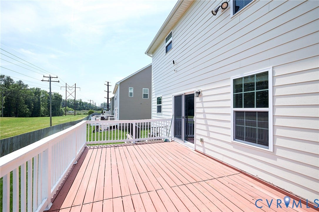 4535 Paxton Glen Court, 3W120, Glen Allen, VA 23059 Expansive outdoor deck with white railing, wood-finish flooring, and direct access to the interior via a sliding glass door