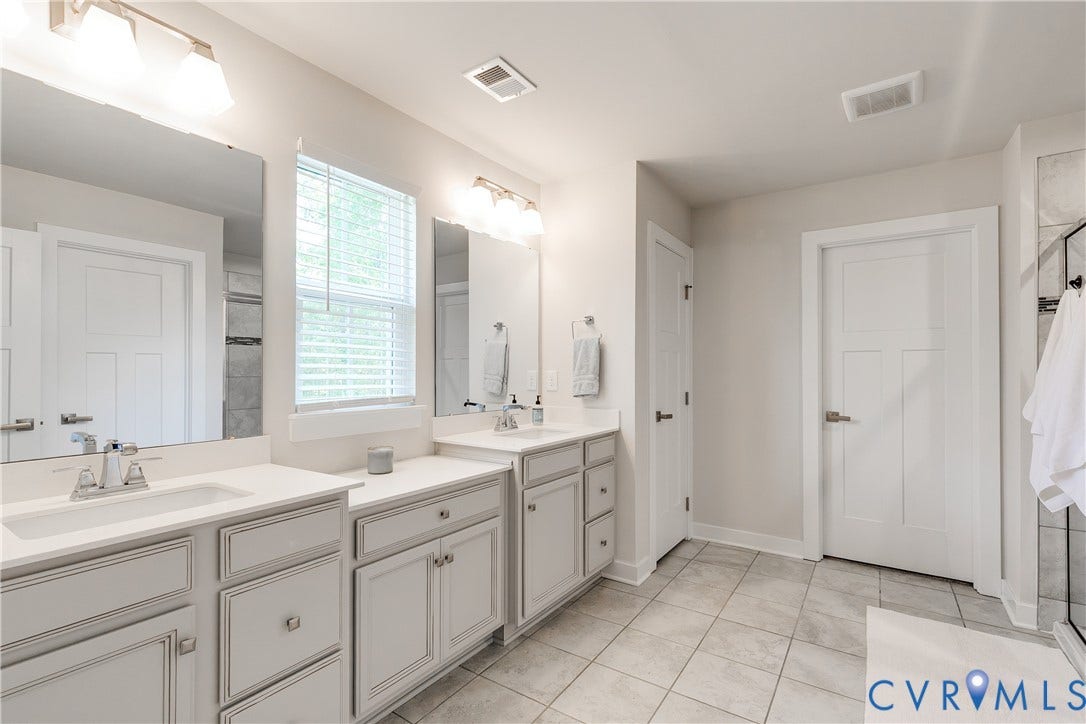 18301 Sagamore Drive, Hampton Pointe, Moseley, VA 23120 Bathroom featuring a double vanity with light gray cabinetry and white countertops