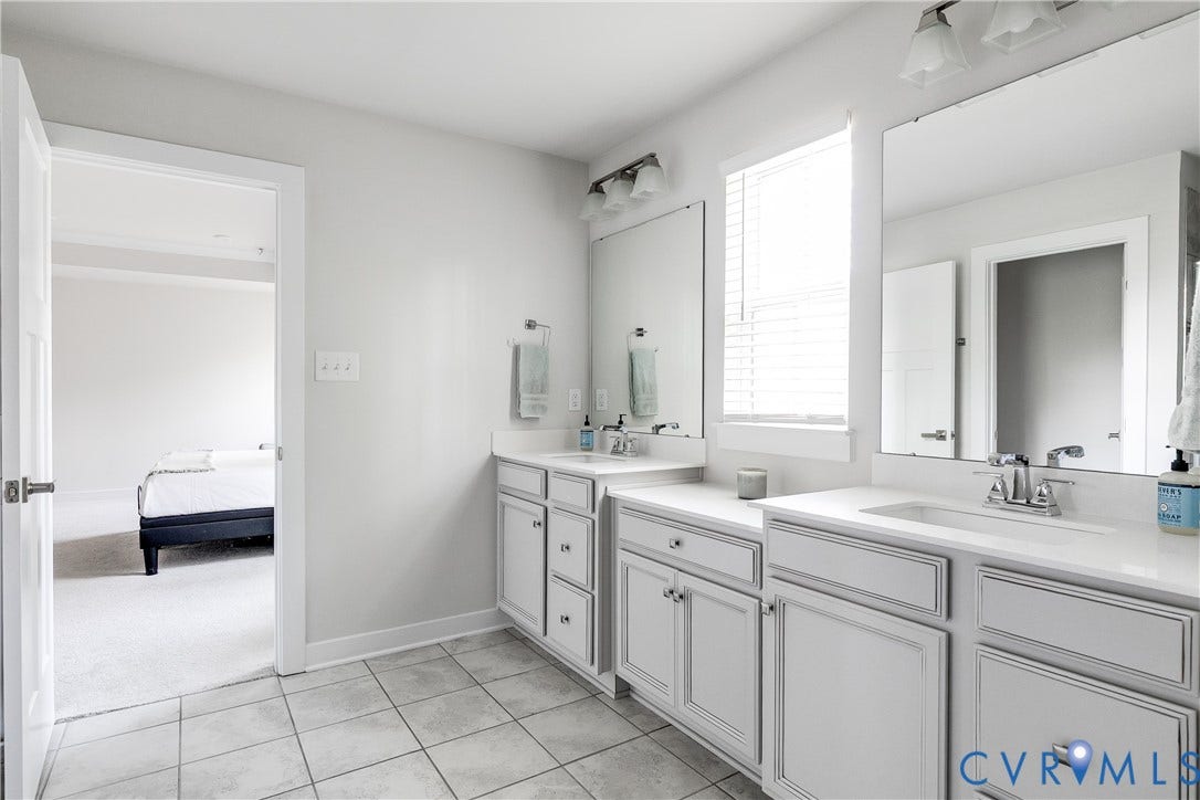18301 Sagamore Drive, Hampton Pointe, Moseley, VA 23120 Dual vanity bathroom featuring gray cabinetry and white countertops