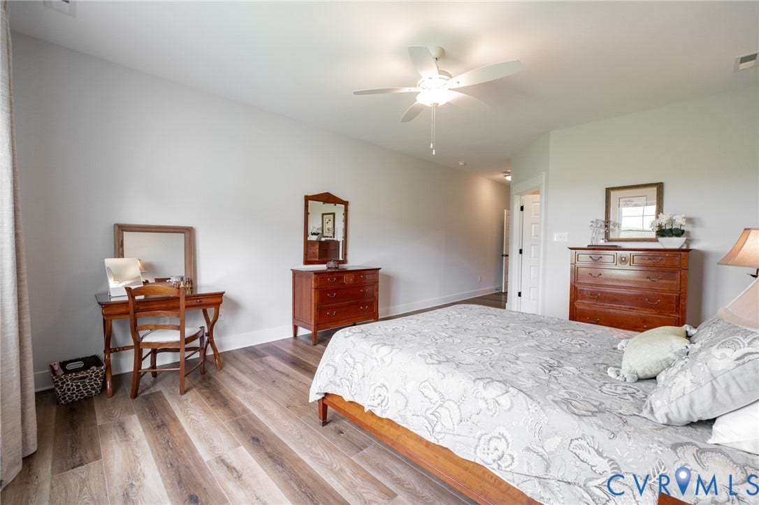 10508 Goosecross Way, Stag's Leap/ Stag's Trail, Hanover, VA 23116 Spacious interior featuring wood-finish flooring, a ceiling fan, and white baseboards