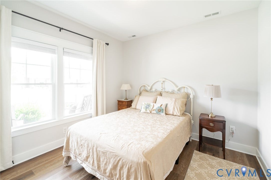 10508 Goosecross Way, Stag's Leap/ Stag's Trail, Hanover, VA 23116 1st floor bedroom featuring wood-finish flooring, crisp white walls, and a large window with white trim