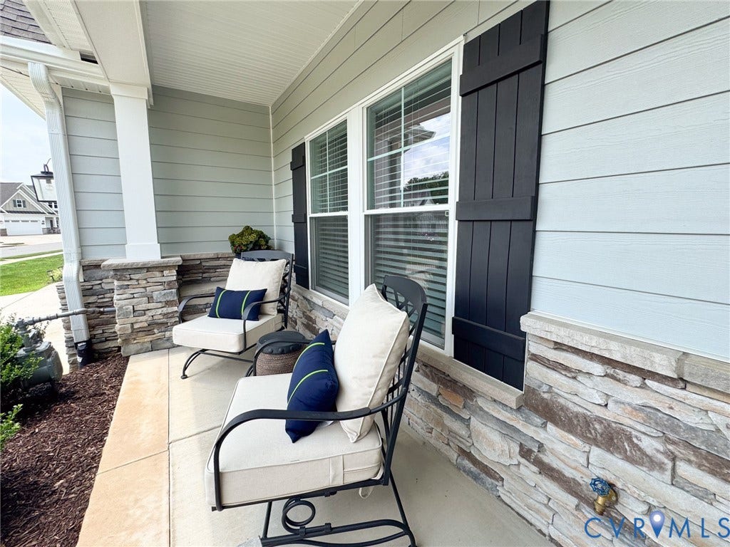 10508 Goosecross Way, Stag's Leap/ Stag's Trail, Hanover, VA 23116 Front porch featuring stone veneer accents, light-colored horizontal siding, and dark board-and-batten shutters