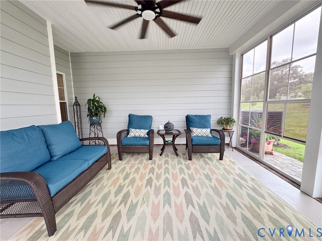 10508 Goosecross Way, Stag's Leap/ Stag's Trail, Hanover, VA 23116 Spacious screened porch featuring a ceiling fan, white beadboard ceiling, light gray siding, and large windows overlooking exterior landscaping