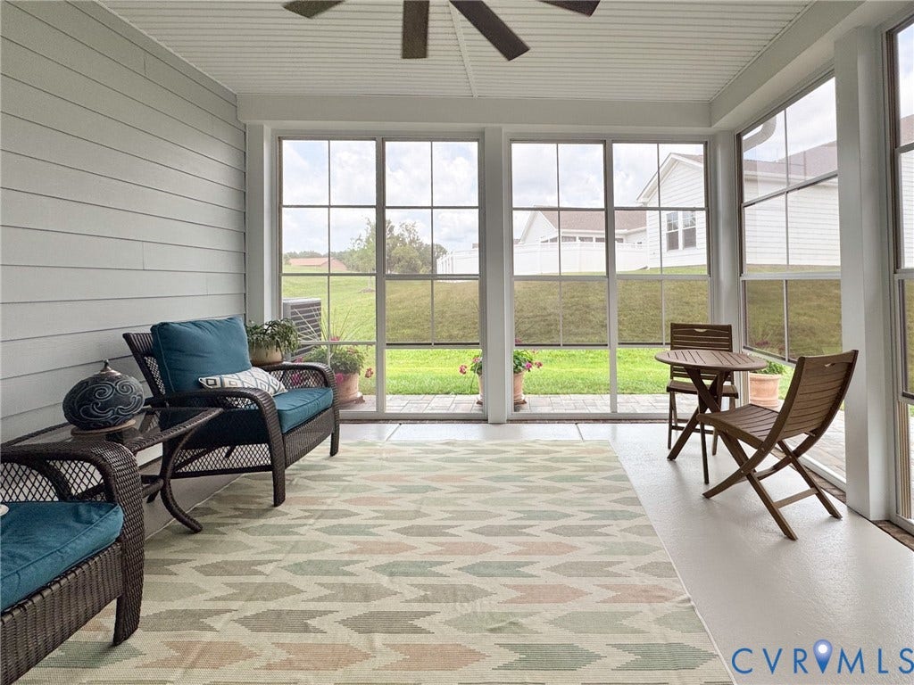 10508 Goosecross Way, Stag's Leap/ Stag's Trail, Hanover, VA 23116 Screened porch featuring a ceiling fan, white siding, and multiple large windows overlooking a spacious lawn