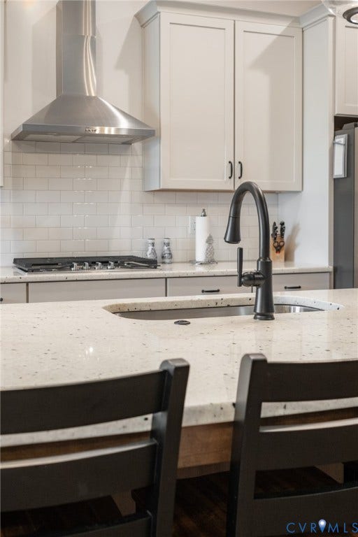 10508 Goosecross Way, Stag's Leap/ Stag's Trail, Hanover, VA 23116 Kitchen island with speckled countertop and integrated sink featuring a matte black gooseneck faucet