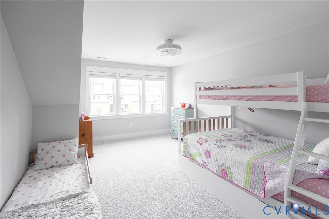 10508 Goosecross Way, Stag's Leap/ Stag's Trail, Hanover, VA 23116 Bright 2nd floor bedroom featuring multiple windows, sloped ceilings, light carpeting, and a ceiling-mounted light fixture