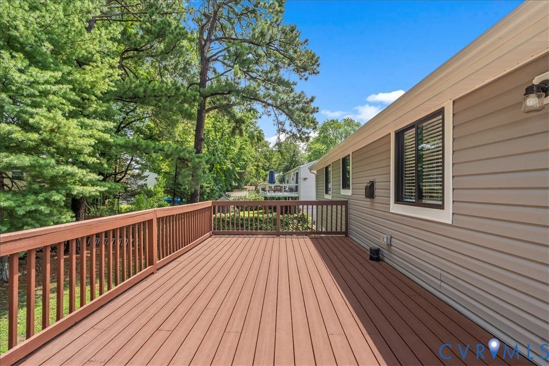 9326 Emmett Road, Glen Allen, VA 23060 Expansive wood-finish deck with full railing overlooking abundant mature trees