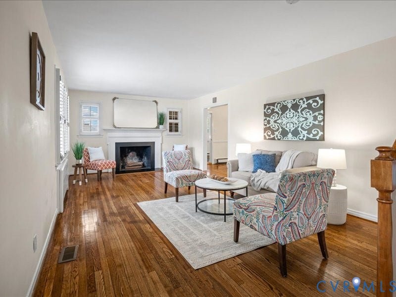 6219 Monument Avenue, St. Mary's Area, Richmond, VA 23226 Spacious Living Room with wood burning fireplace and refinished hardwood floors.