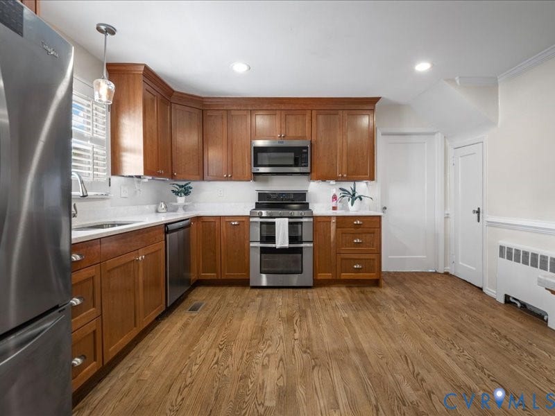 6219 Monument Avenue, St. Mary's Area, Richmond, VA 23226 Remodeled- Warm Cherry cabinets, quartz countertops and stainless appliances.