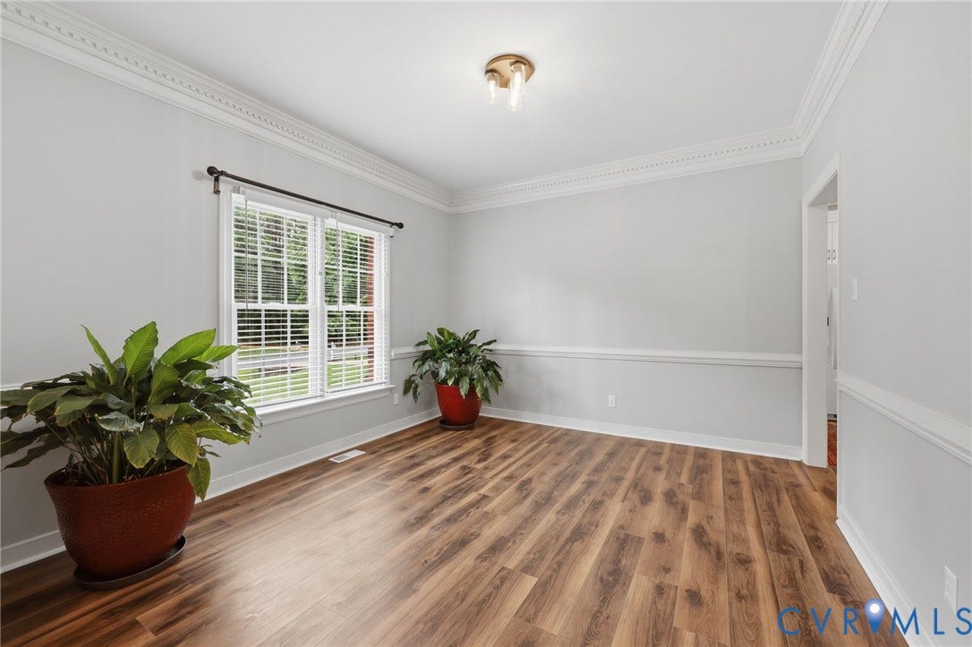 12124 Glen Kilchurn Drive, Chesterfield, VA 23838 Room featuring wood-finish flooring, a double window with blinds, and decorative crown molding