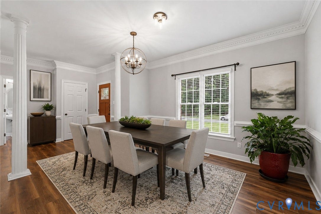 12124 Glen Kilchurn Drive, Chesterfield, VA 23838 Formal dining space featuring wood-finish flooring, an ornate chandelier, decorative columns, and extensive crown molding