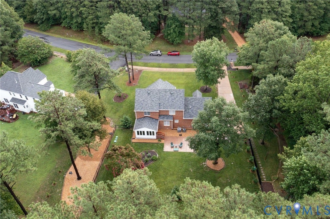 12124 Glen Kilchurn Drive, Chesterfield, VA 23838 Brick residence featuring a shingled roof and an attached sunroom