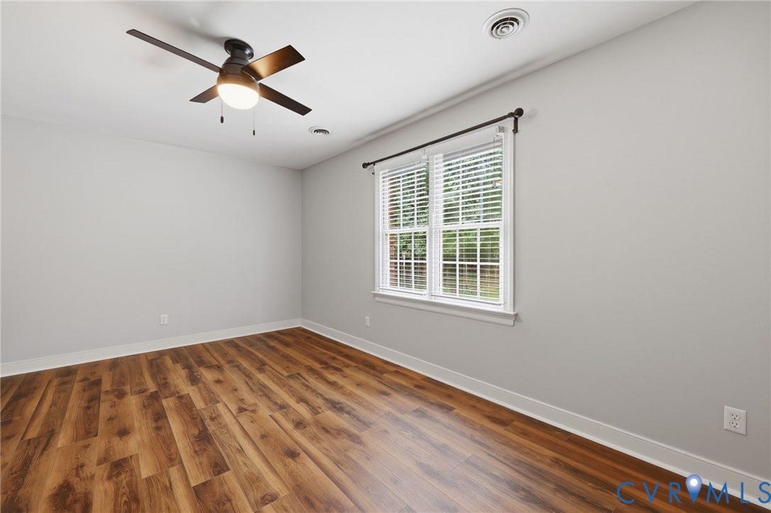 12124 Glen Kilchurn Drive, Chesterfield, VA 23838 Spacious room featuring wood-finish flooring, light grey walls, and white baseboards
