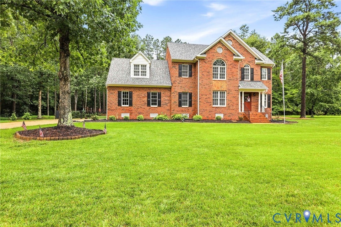 12124 Glen Kilchurn Drive, Chesterfield, VA 23838 Brick exterior featuring a gabled roof and arched window above the entry