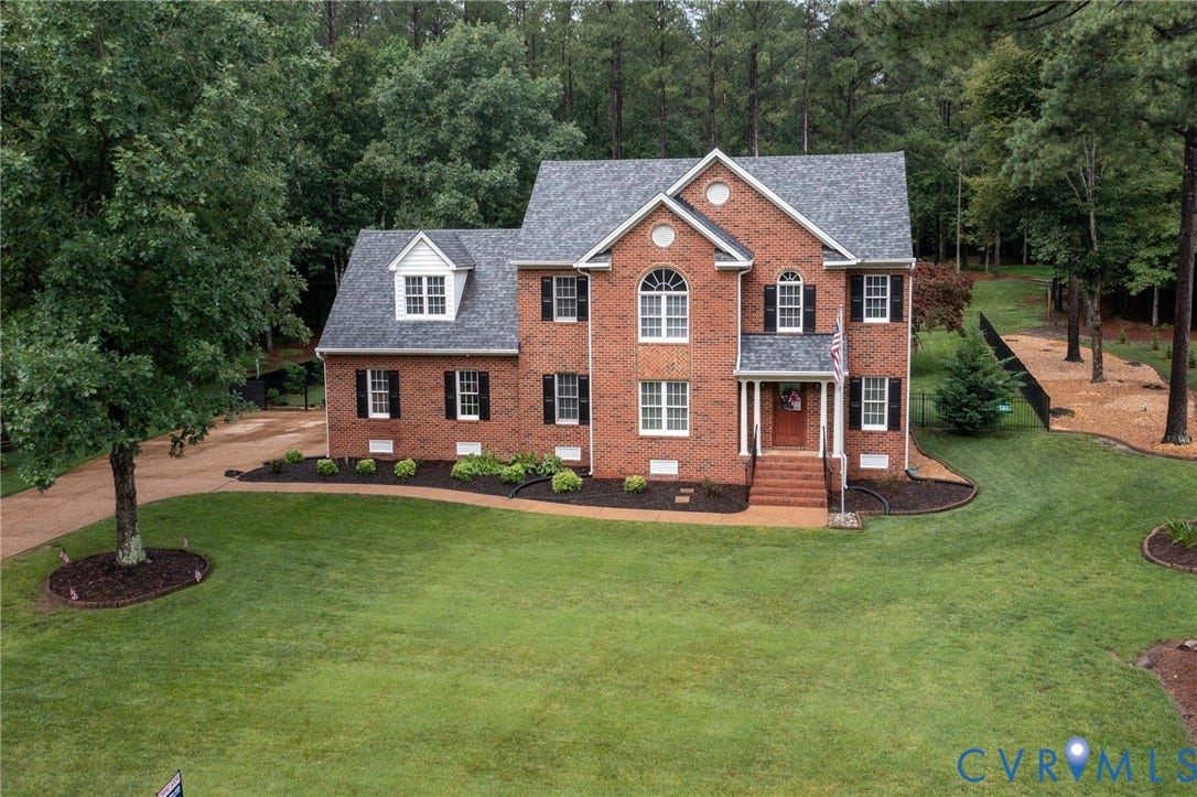 12124 Glen Kilchurn Drive, Chesterfield, VA 23838 Brick exterior featuring a gabled roof and arched window