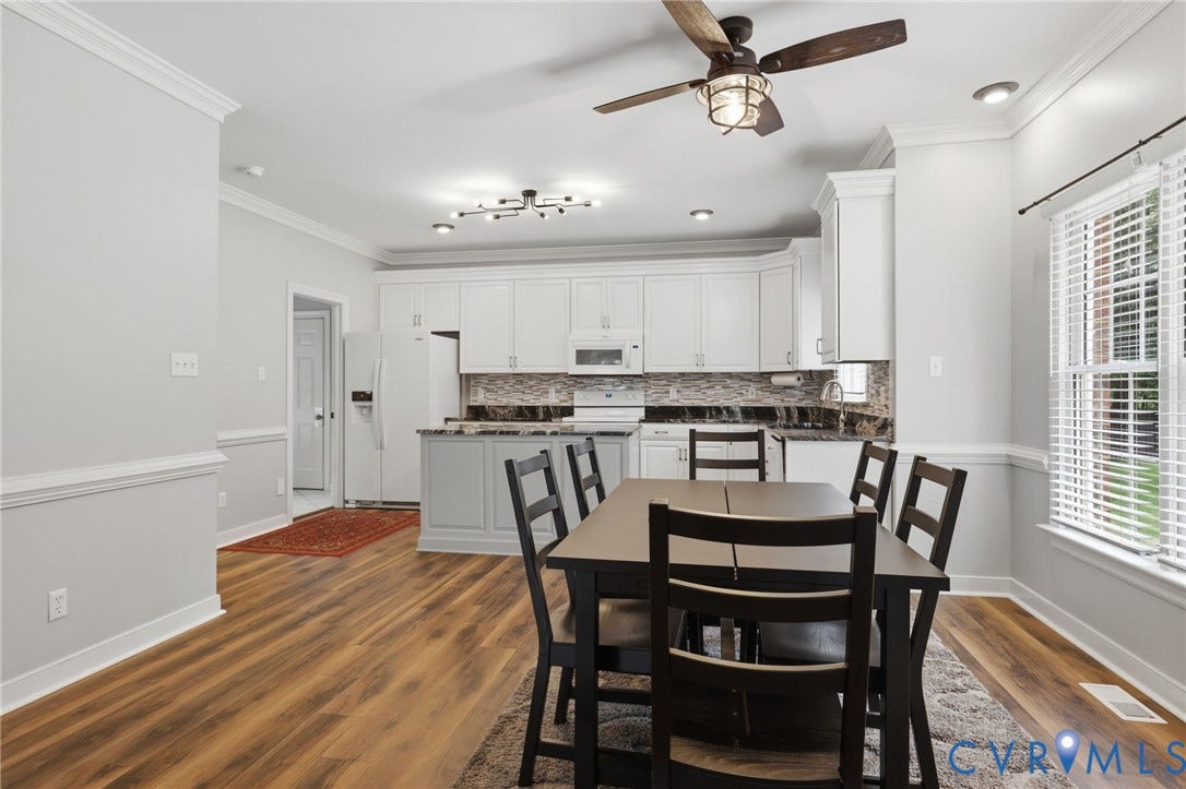 12124 Glen Kilchurn Drive, Chesterfield, VA 23838 Open-concept dining area with wood-finish flooring, crown molding, and a ceiling fan