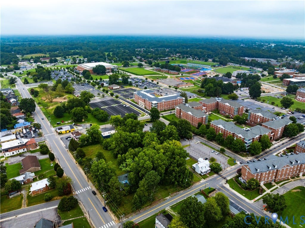 Aerial perspective showcasing a developed area with extensive green spaces