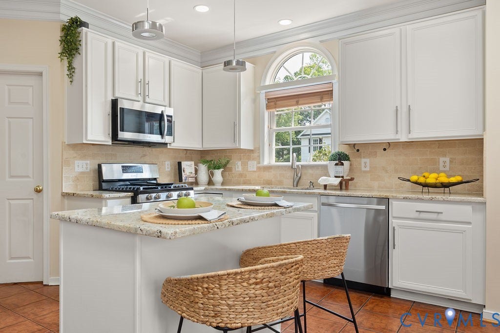 5316 Lemoore Drive, Glen Allen, VA 23059 Kitchen featuring white cabinetry, granite countertops, stainless steel appliances, a tiled backsplash, and an arched window