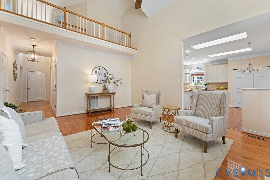 5316 Lemoore Drive, Glen Allen, VA 23059 Vaulted ceilings enhance this living space featuring warm wood-finish flooring